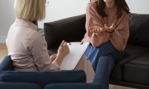 full-shot-young-woman-undergoing-therapy Female in counselling for Breaking Free from Negative Relationship Patterns