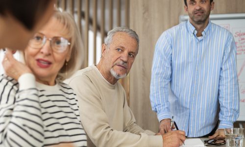 side-view-people-studying-classroom Couple standing with their in laws and trying to set healthy boundaries with in-laws.